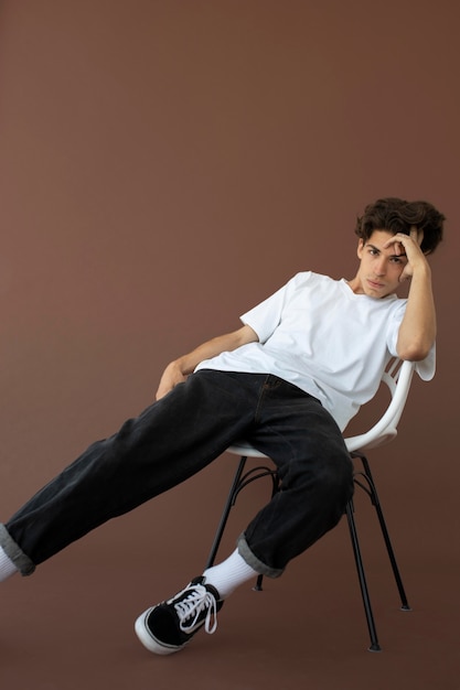 Teenager boy in stylish clothes posing