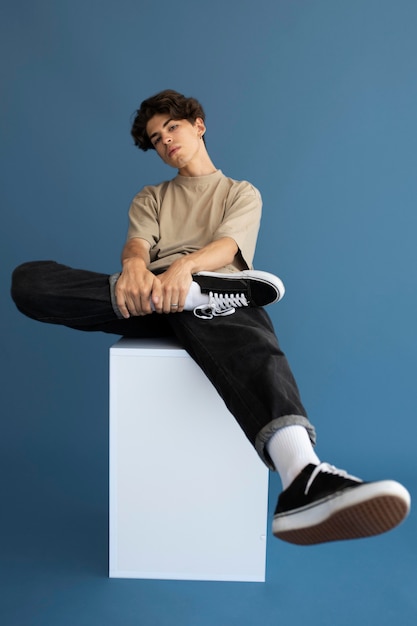 Teenager boy in stylish clothes posing