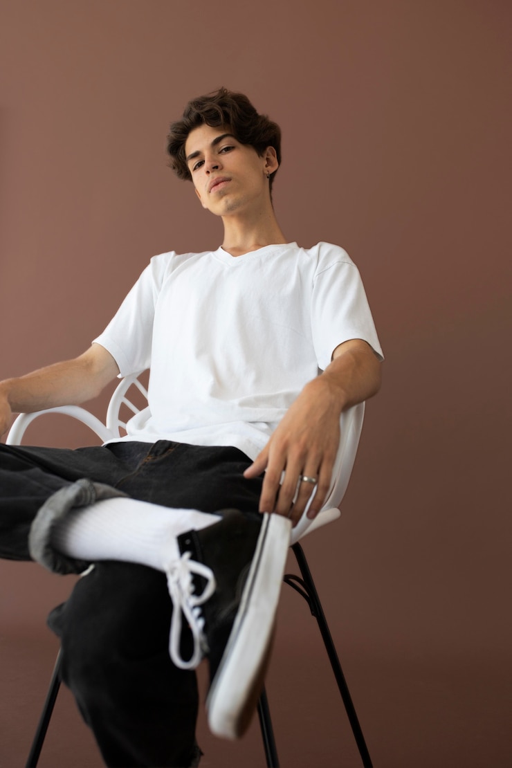 Free Photo teenager boy in stylish clothes posing
