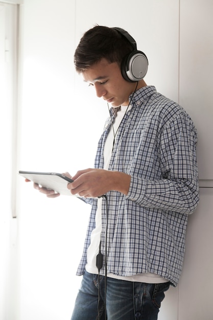 Teenager browsing tablet