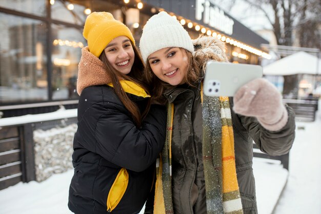 Teenager friends having fun in winter time