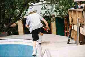 Free photo teenager getting out from bowl