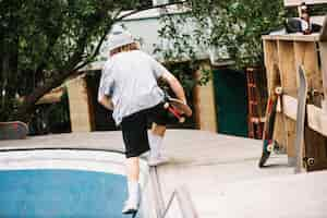 Free photo teenager getting out from bowl