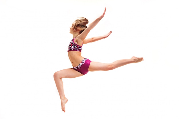 teenager girl doing gymnastics exercises on white