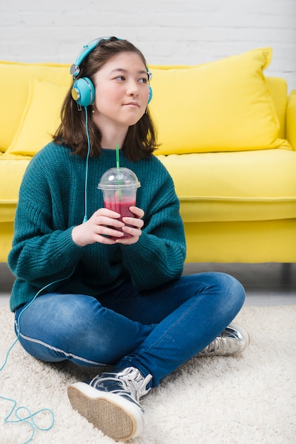 Teenager girl having juice