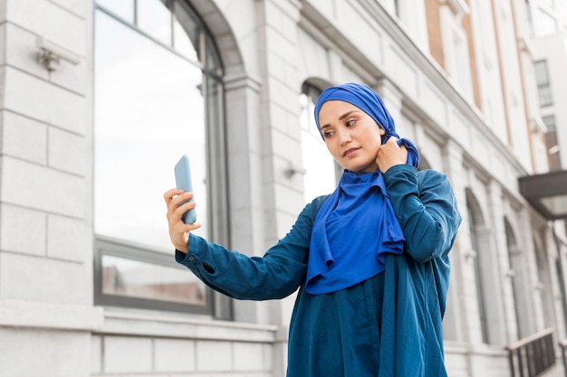 Teenager girl taking a selfie outdoors