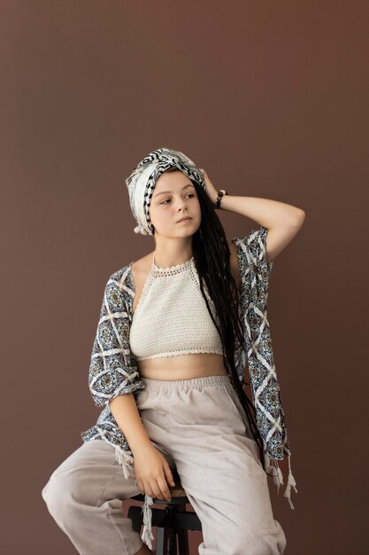 Teenager girl with hippie clothes and dreadlocks