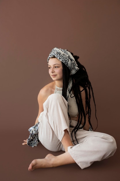 Teenager girl with hippie clothes and dreadlocks