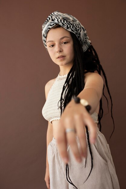 Teenager girl with hippie clothes and dreadlocks