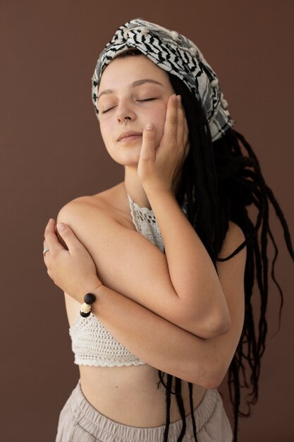Teenager girl with hippie clothes and dreadlocks