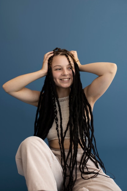 Teenager girl with hippie clothes and dreadlocks