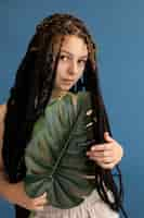 Free photo teenager girl with hippie clothes and dreadlocks