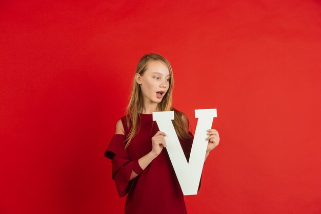 Teenager holding letter V