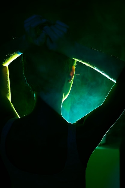 teenager in the light of movie projector