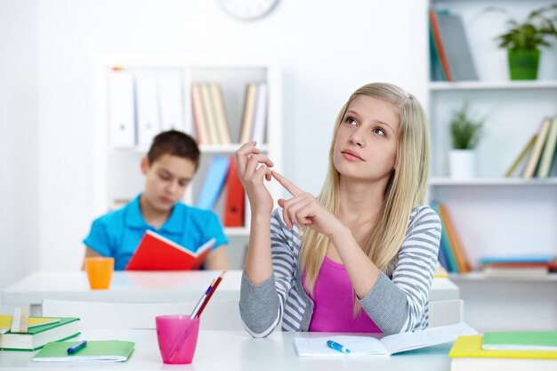 Teenager looking up in class