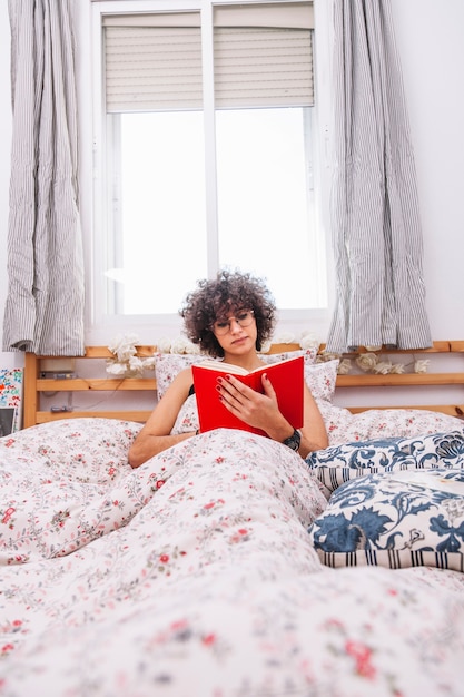 Teenager reading in morning