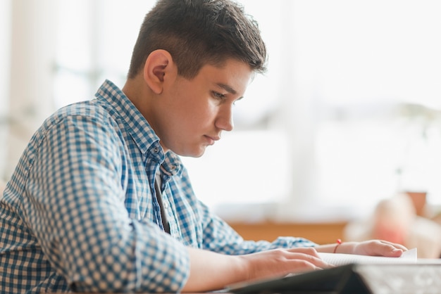 Teenager reading nice book