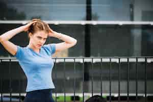 Free photo teenager smoothing hair