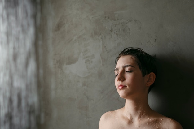 Teenager washing to reduce hangover effect