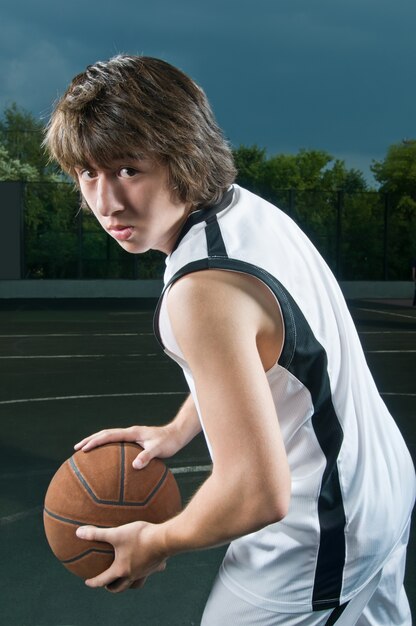 Teenager with basketball