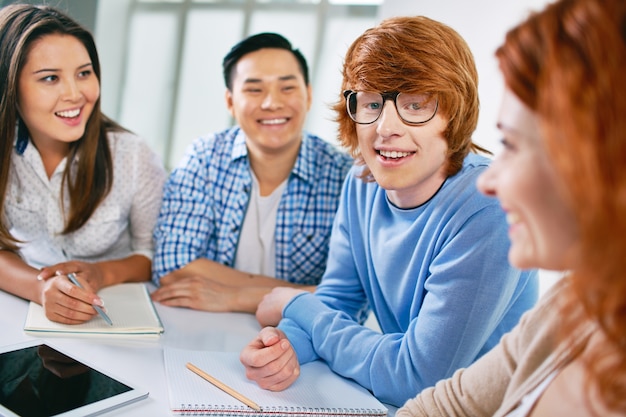 Teenager with glasses laughing