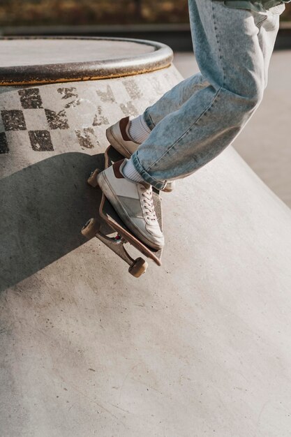 Teenager with skateboard having fun