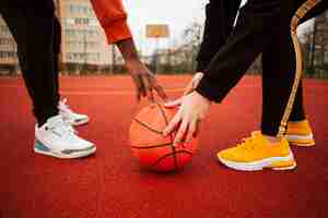 Free photo teenagers at the basketball field together