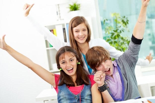 Teenagers having fun in class