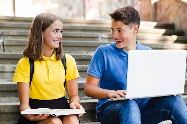 Teenagers studying and having fun