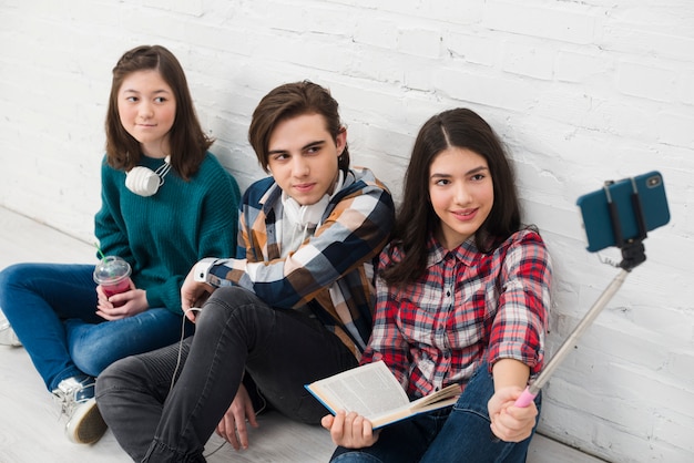 Free photo teenagers taking a selfie