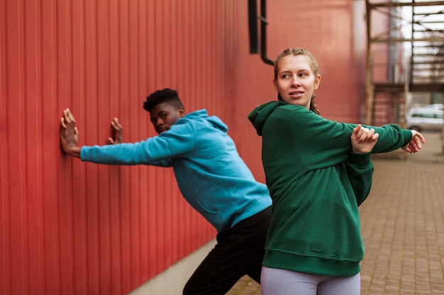 Teenagers training together outdoors