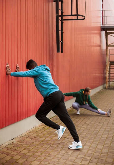 Teenagers training together outdoors