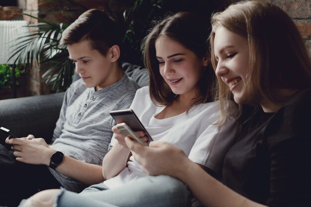 Teenagers using mobile phones using mobile phones