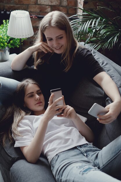 Teenagers using mobile phones