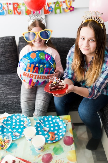 Teenagers with piece of cake