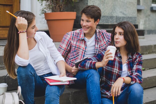 Teens relaxing on staircase