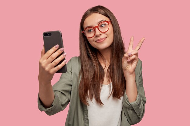 Tender content European woman makes selfie portrait