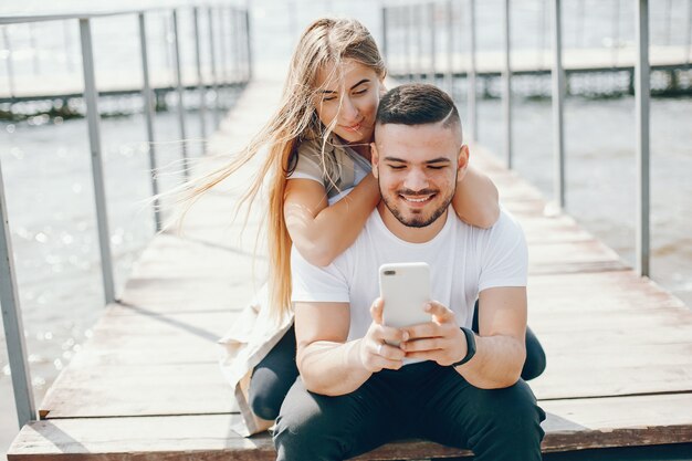 tender and merry lovers are having a good time at the lake