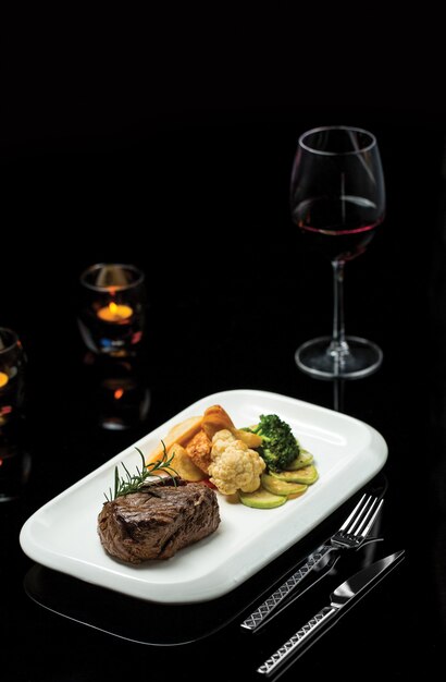 Tenderloin steak with snacks and sauces