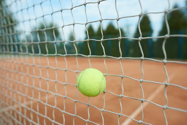 Tennis ball is hitting the net