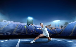 Tennis girl on a professional tennis court