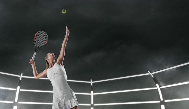 Tennis girl on a professional tennis court