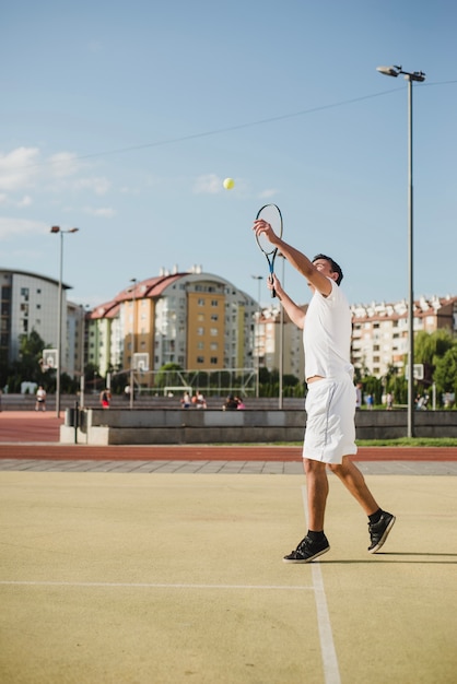 Free photo tennis player in city environment