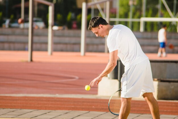 Tennis player preparing to serve