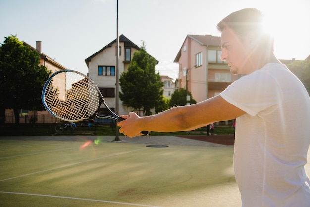 Free photo tennis player and sun effect