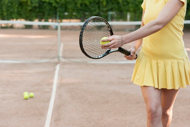 Tennis player with her racket