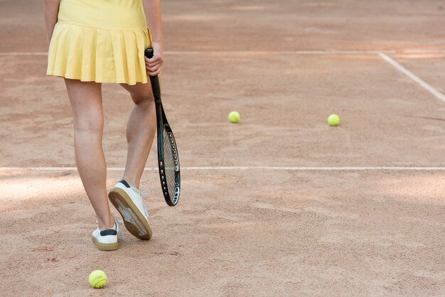 Tennis player with her racket