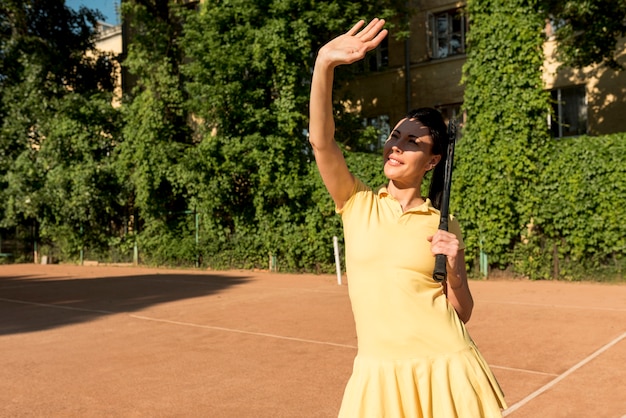 Tennis player with her racket