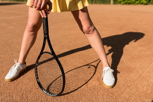 Tennis player with her racket