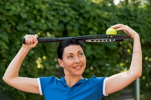 Tennis player with her racket